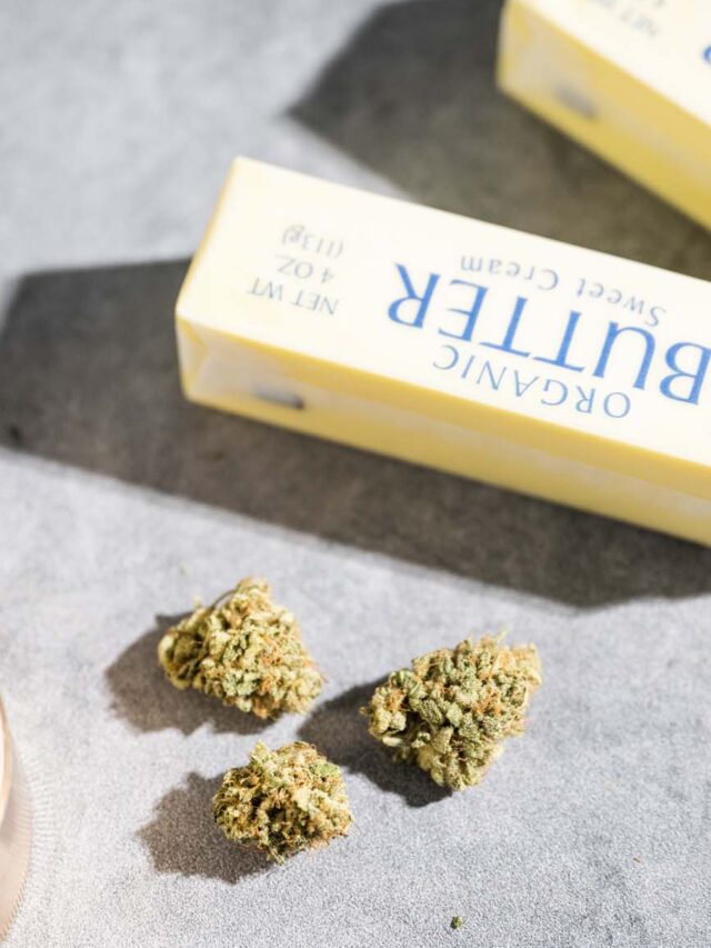 Sticks of butter next to cannabis.