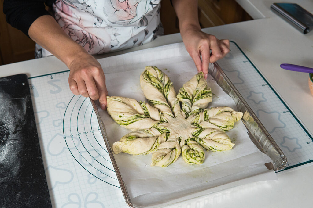 woman shaping pesto cannabis bread